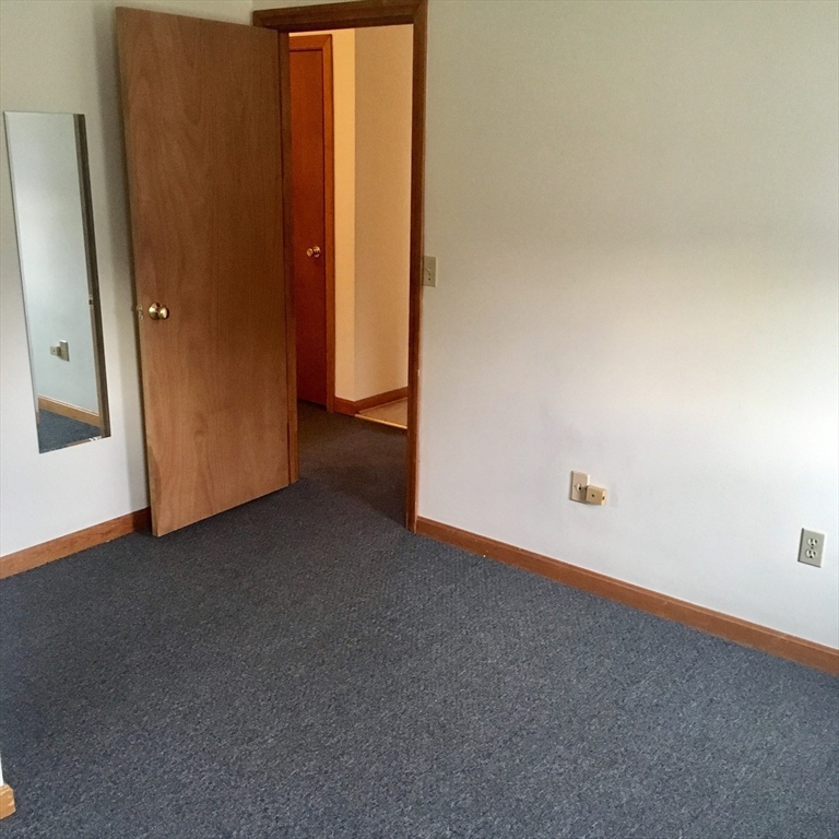 17 Grafton Street, Unit 2 Quincy, MA 02169 - Photo 17 of 25 an empty room with windows