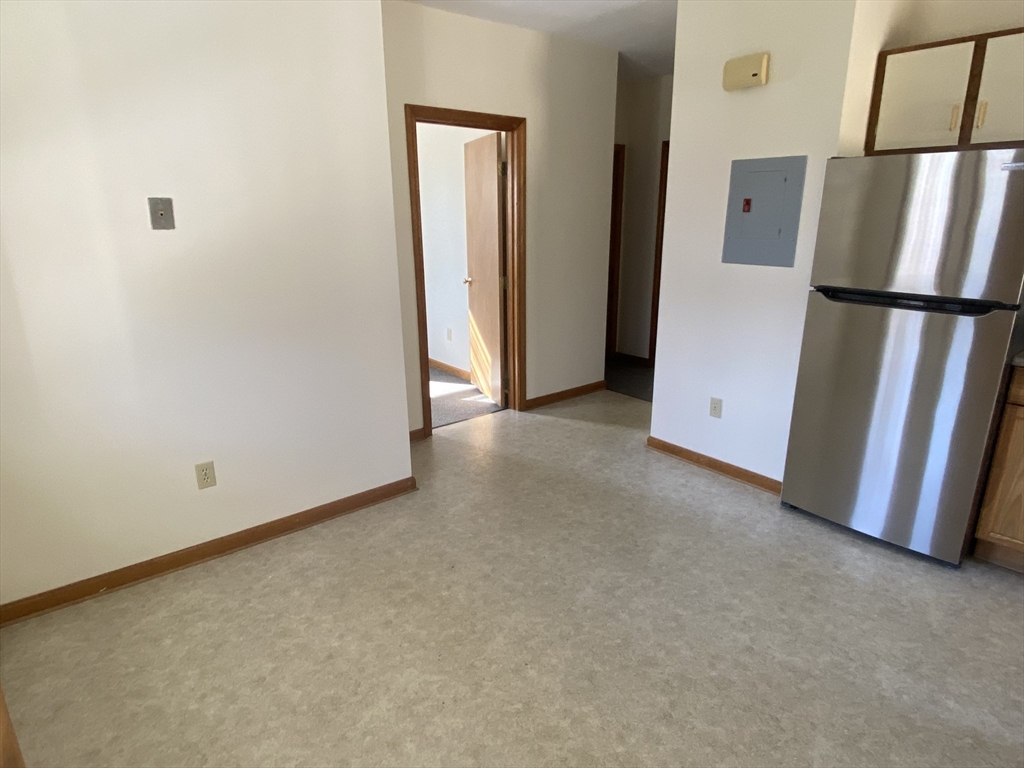 17 Grafton Street, Unit 2 Quincy, MA 02169 - Photo 25 of 25 a view of an empty room with a refrigerator