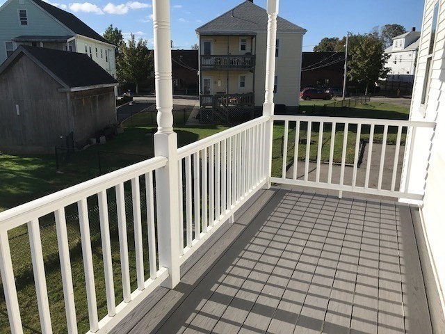 17 Grafton Street, Unit 2 Quincy, MA 02169 - Photo 4 of 25 a view of a balcony with wooden floor
