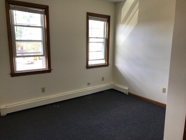 17 Grafton Street, Unit 2 Quincy, MA 02169 - Photo 9 of 25 an empty room with a window