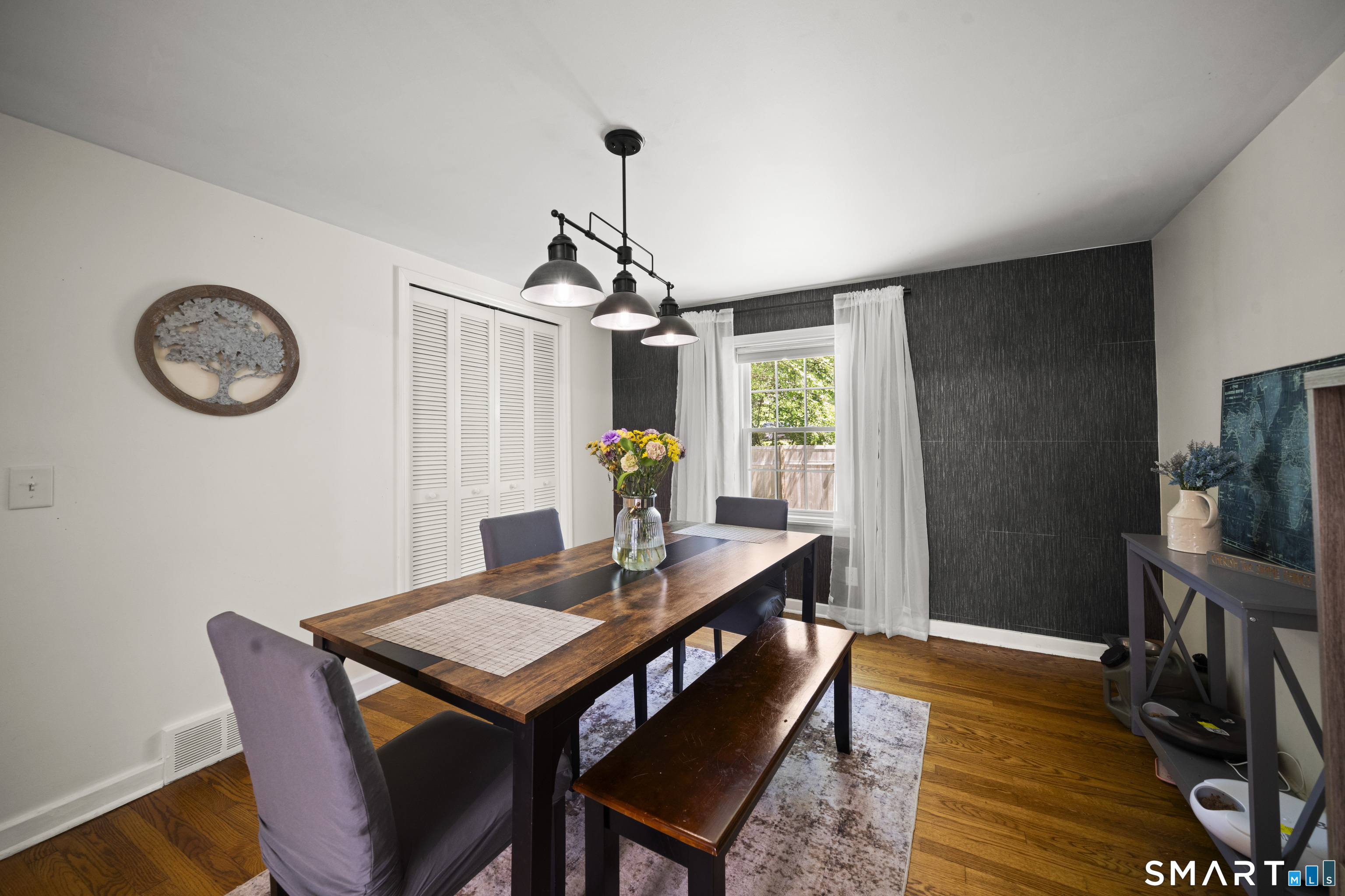 211 Whisconier Road Brookfield, CT 06804 - Photo 10 of 38 a view of a dining room with furniture window and wooden floor