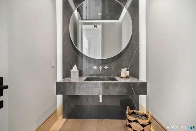 a bathroom with a sink and a mirror