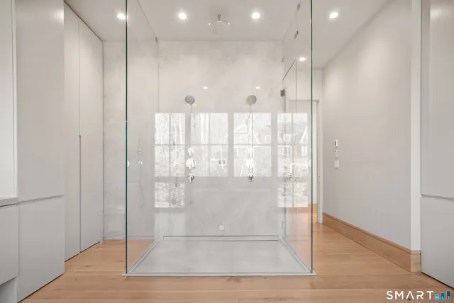 a view of a hallway with wooden floor