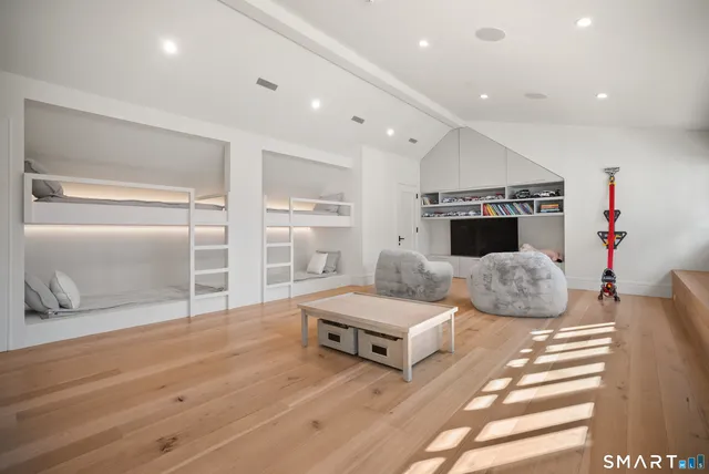 a bedroom with furniture and a fireplace