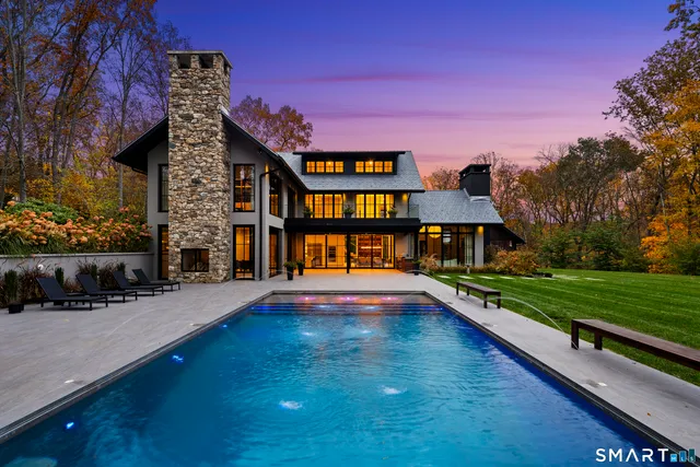 a view of swimming pool with a yard and sitting area