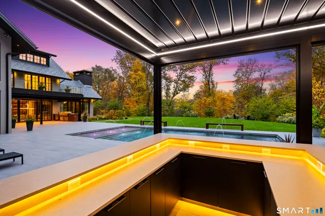 a view of swimming pool with seating area