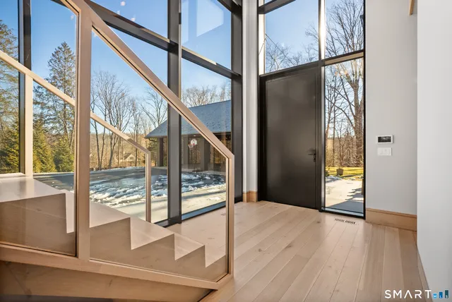 a view of an entryway with wooden floor
