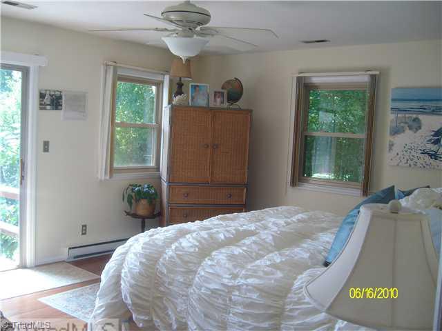 415 Lindsey Road Reidsville, NC 27320 - Photo 11 of 16 Master Bedroom. With access to deck overlooking lake