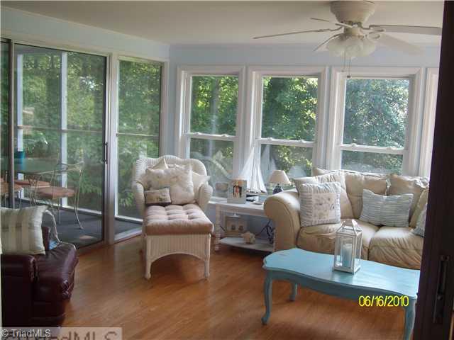415 Lindsey Road Reidsville, NC 27320 - Photo 10 of 16 Sunroom. View from living room of sunroom with access to screened in porch off of dining room.