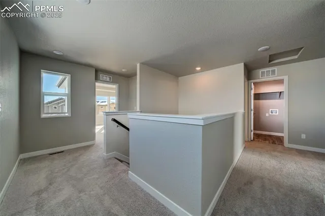 a view of an empty room and window