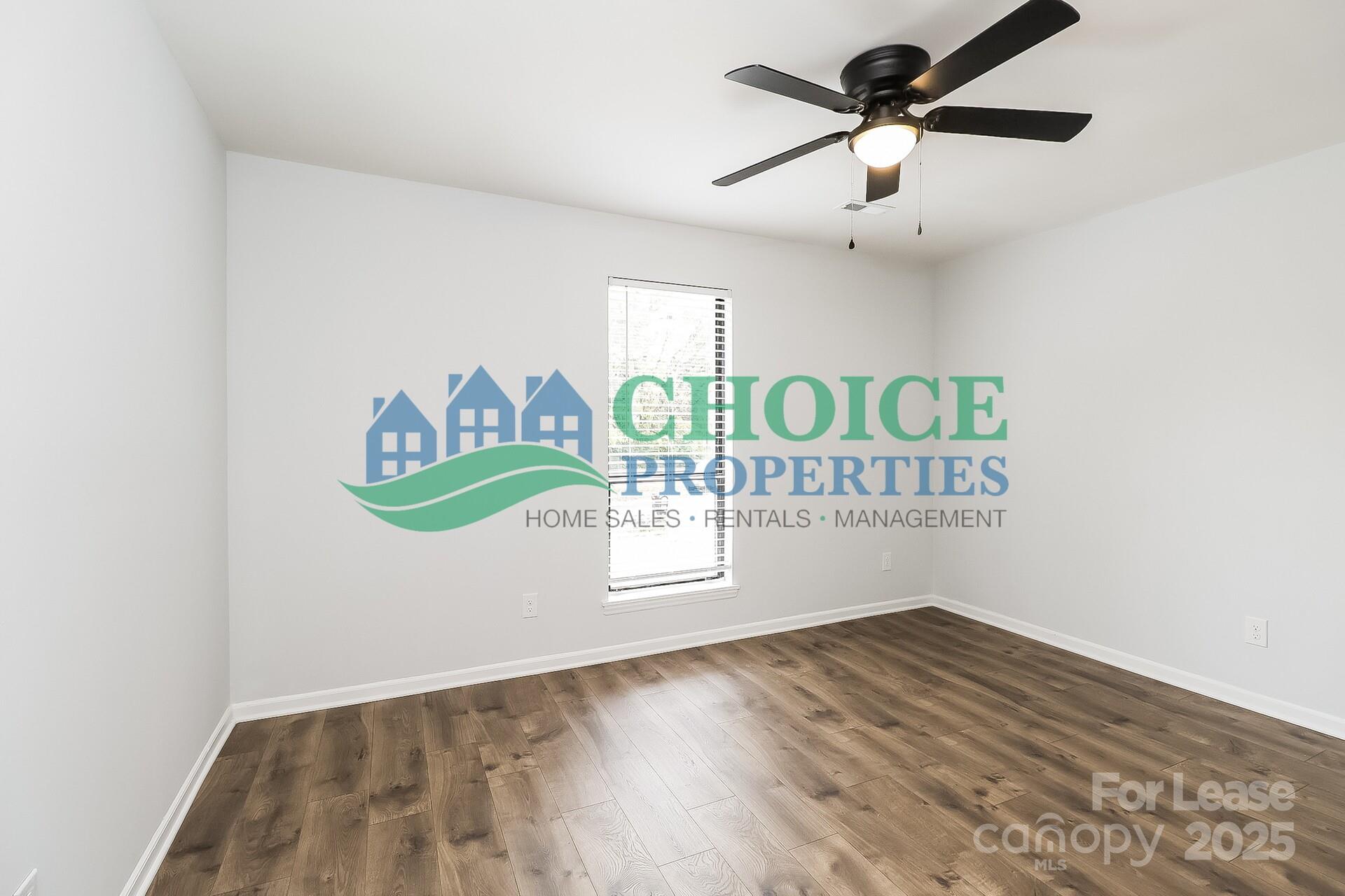 10319 Osprey Drive Pineville, NC 28134 - Photo 11 of 16 a view of kitchen with stainless steel appliances granite countertop a stove a sink and a wooden floor
