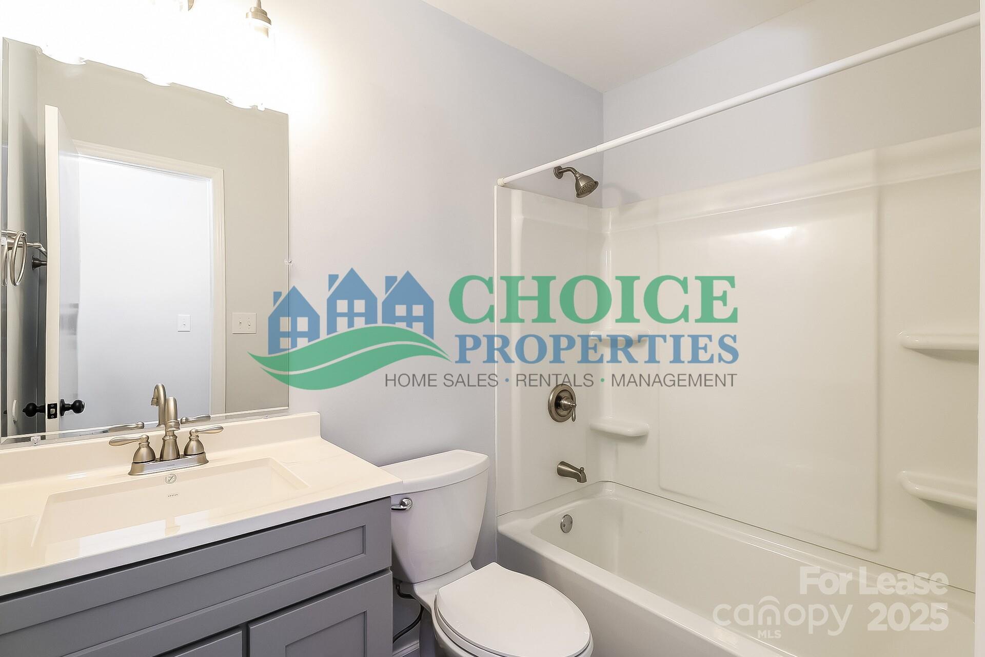 10319 Osprey Drive Pineville, NC 28134 - Photo 14 of 16 a bathroom with a sink a toilet and shower