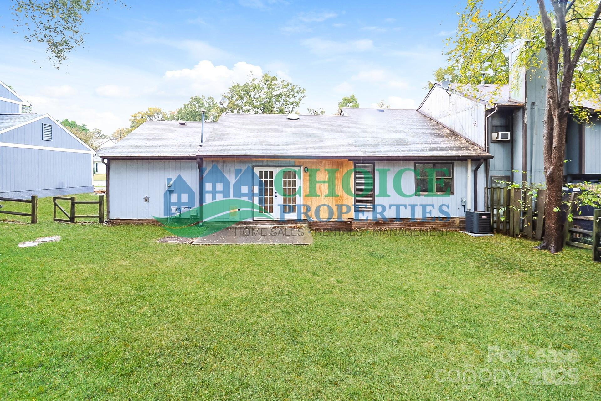 10319 Osprey Drive Pineville, NC 28134 - Photo 16 of 16 a front view of house with yard and seating area