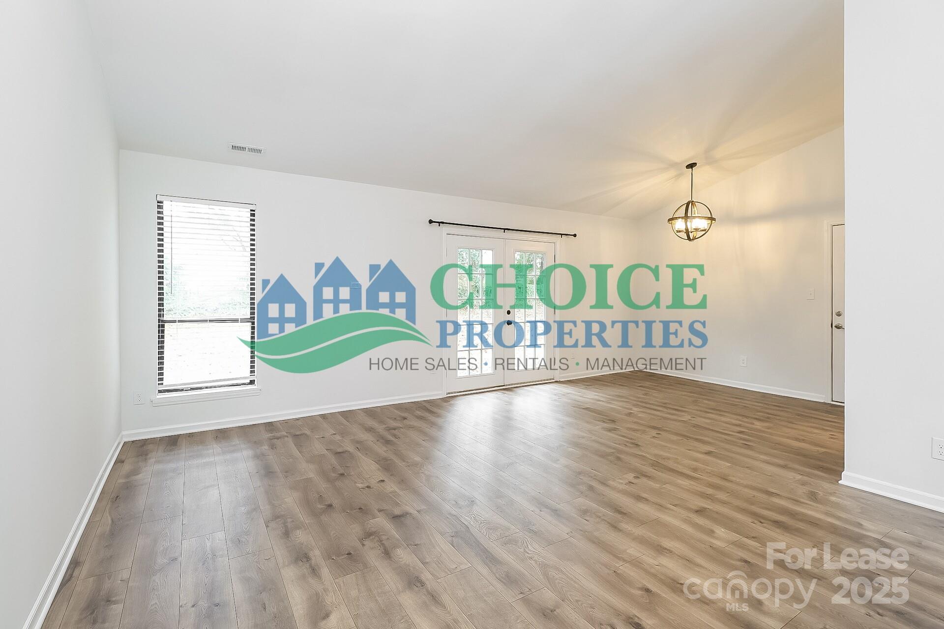 10319 Osprey Drive Pineville, NC 28134 - Photo 5 of 16 a view of an entryway with wooden floor