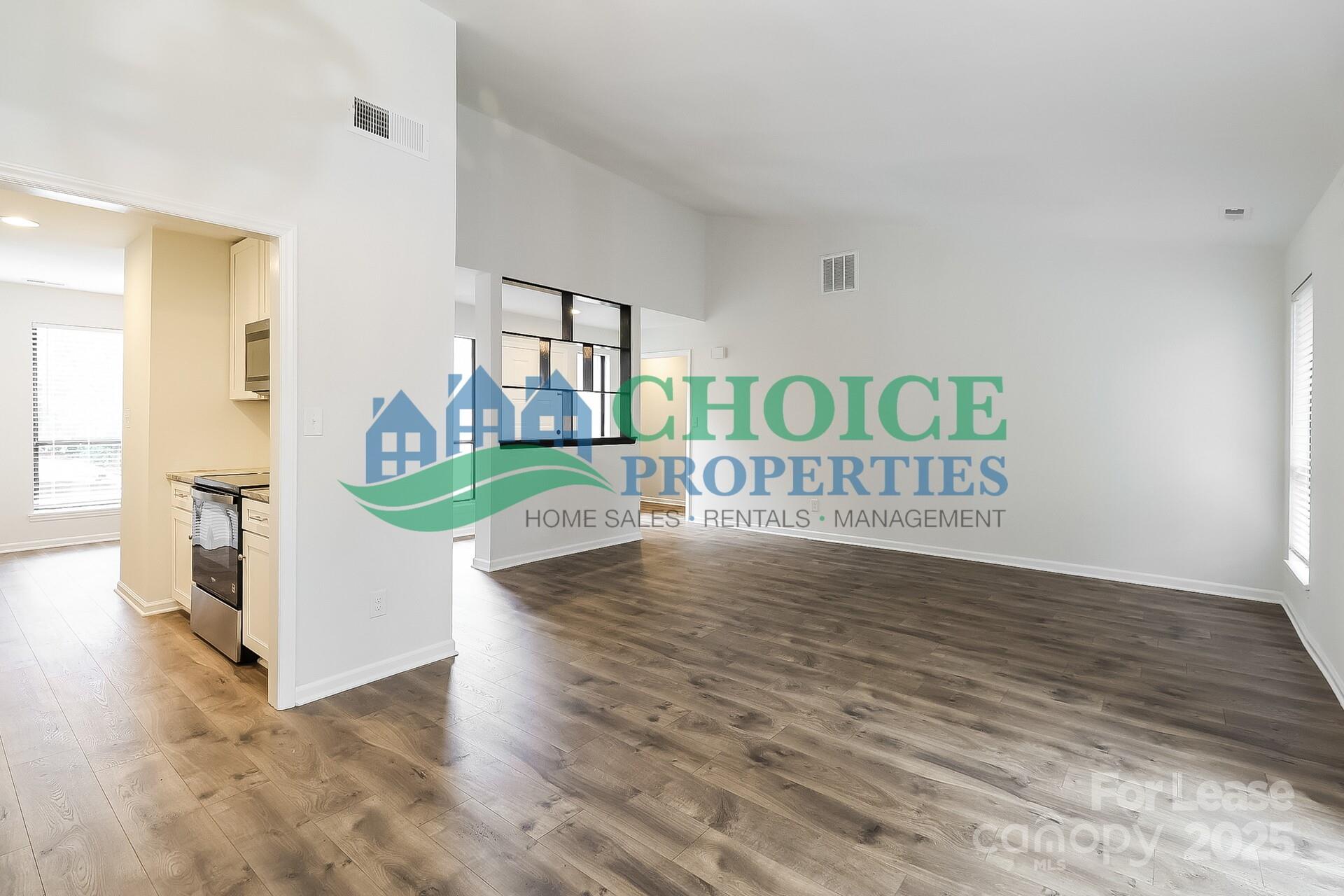 10319 Osprey Drive Pineville, NC 28134 - Photo 6 of 16 a view of an entryway with wooden floor