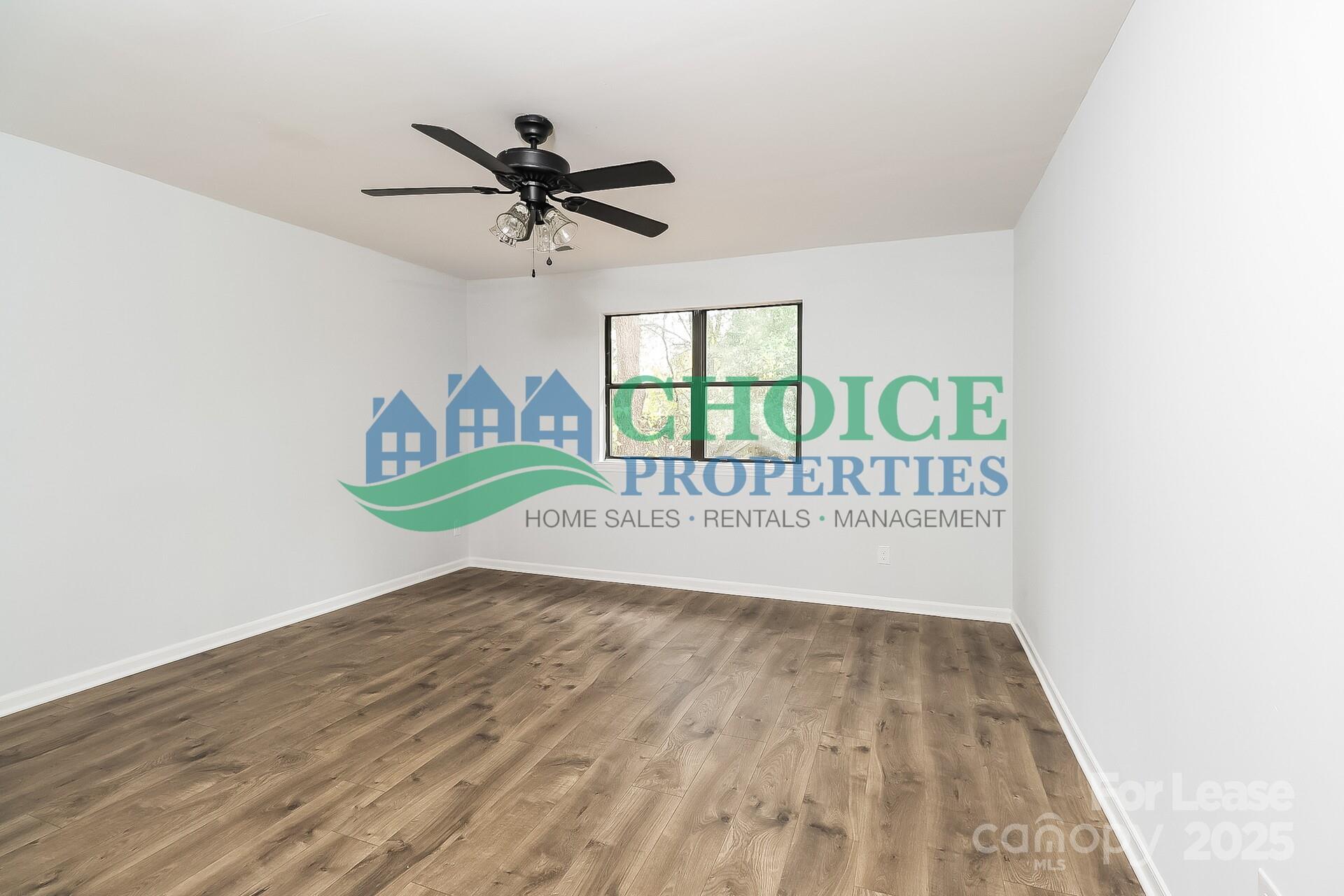 10319 Osprey Drive Pineville, NC 28134 - Photo 10 of 16 a view of a room with a wooden floor