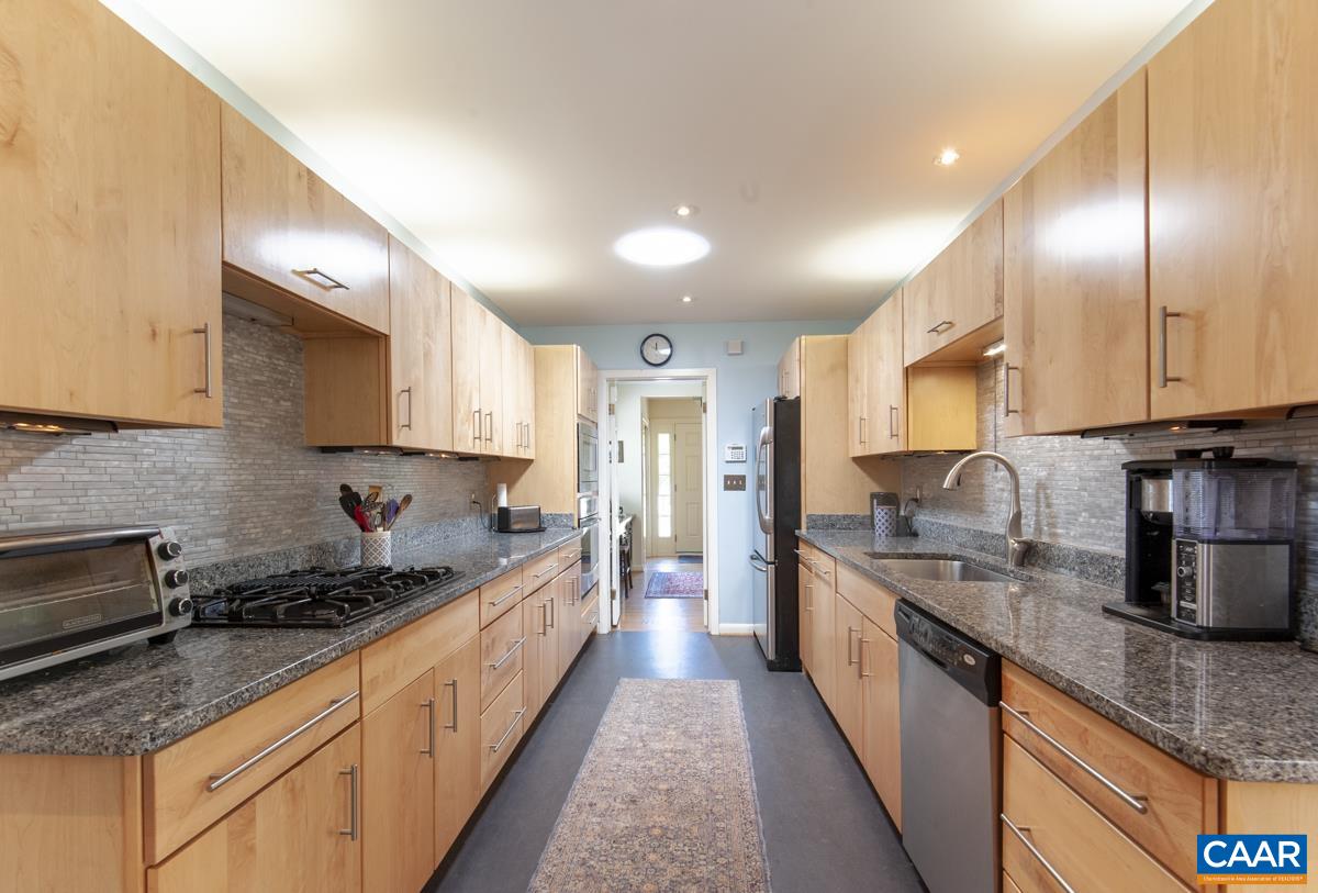 2306 Tarleton Drive Charlottesville, VA 22901 - Photo 13 of 35 a large kitchen with stainless steel appliances granite countertop a sink a stove and a refrigerator