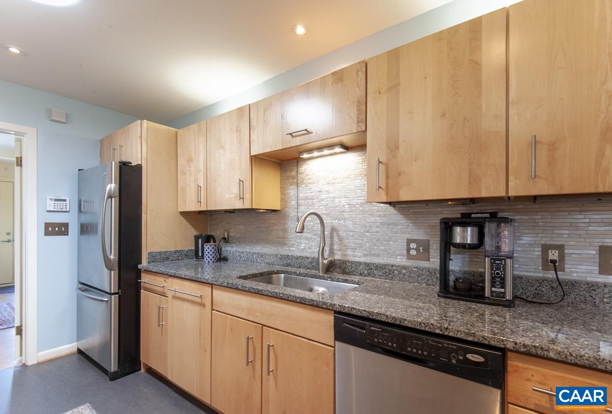 2306 Tarleton Drive Charlottesville, VA 22901 - Photo 14 of 35 a kitchen with stainless steel appliances granite countertop a sink a stove and a refrigerator