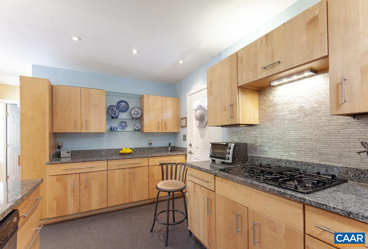 2306 Tarleton Drive Charlottesville, VA 22901 - Photo 15 of 35 a kitchen with a sink a stove and cabinets