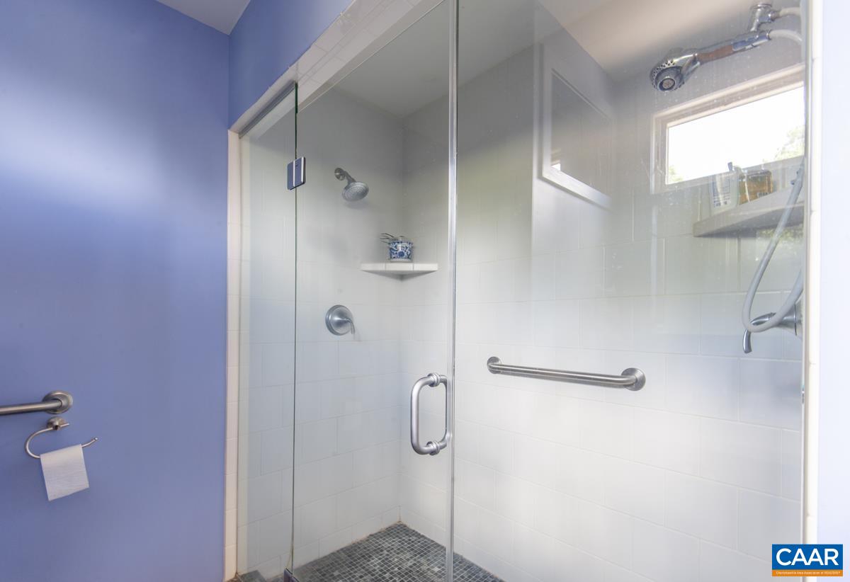 2306 Tarleton Drive Charlottesville, VA 22901 - Photo 21 of 35 a bathroom with a glass shower door