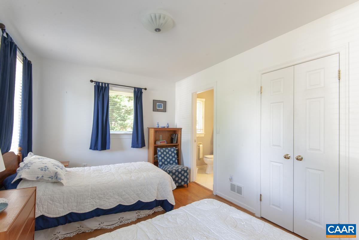 2306 Tarleton Drive Charlottesville, VA 22901 - Photo 25 of 35 a bedroom with a bed and wooden floor
