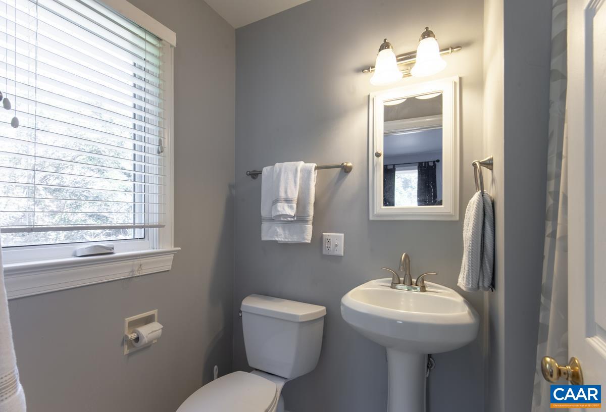 2306 Tarleton Drive Charlottesville, VA 22901 - Photo 27 of 35 a bathroom with a toilet sink and mirror