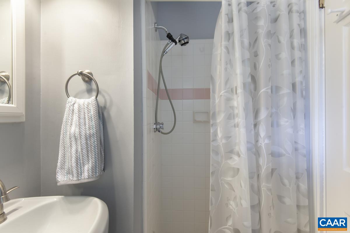 2306 Tarleton Drive Charlottesville, VA 22901 - Photo 28 of 35 a bathroom with a shower curtain