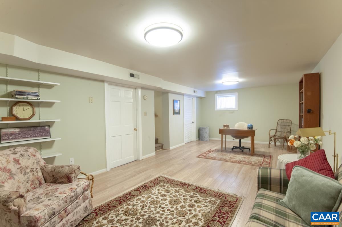 2306 Tarleton Drive Charlottesville, VA 22901 - Photo 31 of 35 a living room with furniture and a rug