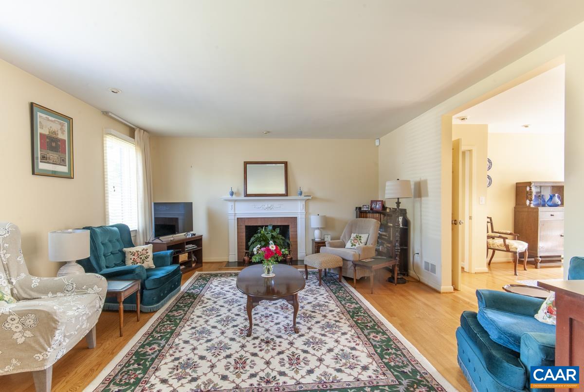 2306 Tarleton Drive Charlottesville, VA 22901 - Photo 8 of 35 a living room with furniture and a fireplace