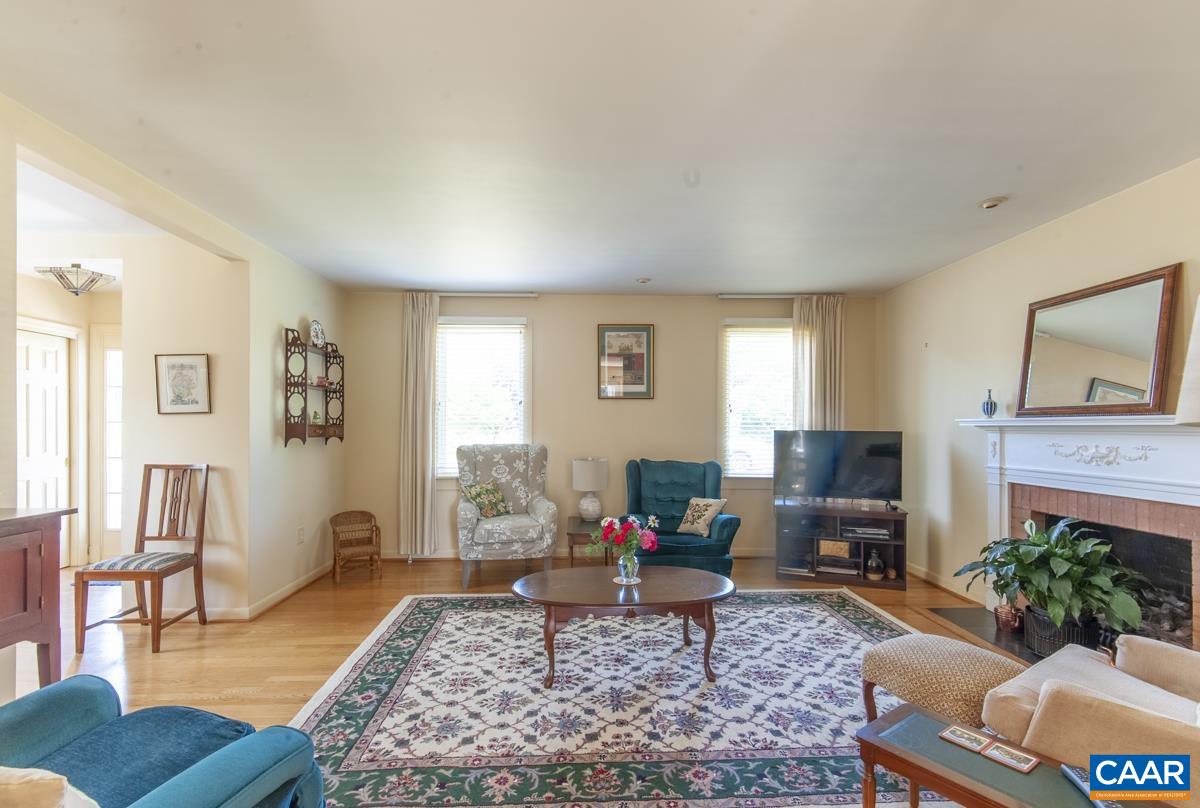 2306 Tarleton Drive Charlottesville, VA 22901 - Photo 10 of 35 a living room with furniture and a rug