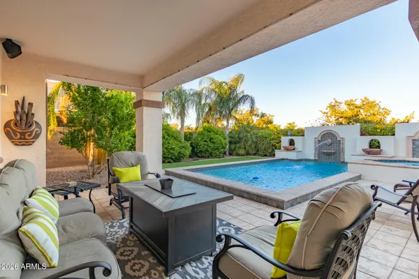 a living room with furniture and a swimming pool