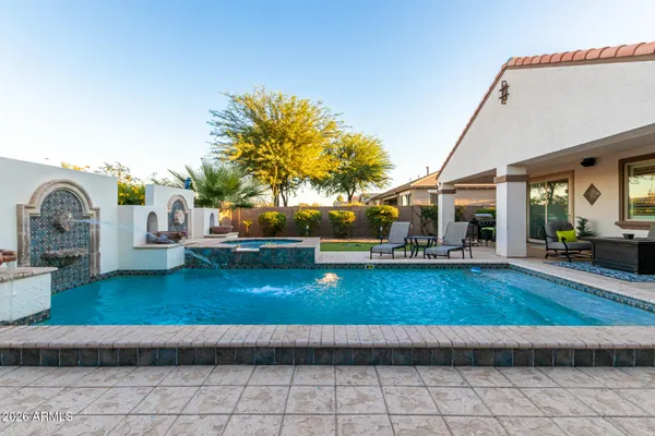 a swimming pool with barbeque oven