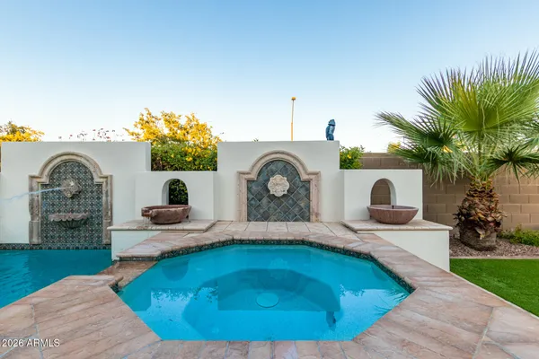 a view of a house with a swimming pool and outdoor space
