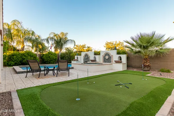 a view of a backyard with a patio