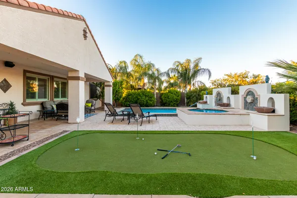 a view of a house with a backyard