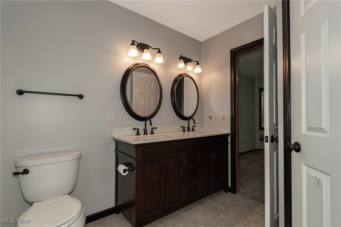 4815 South Ridge Road Perry, OH 44081 - Photo 16 of 48 Full bathroom with double vanity and light tile patterned floors