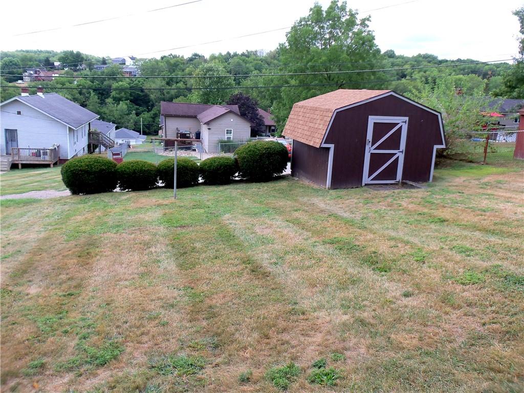 306 Silver Maple Avenue Langeloth, PA 15054 - Photo 28 of 31 a view of a house with a yard and sitting area