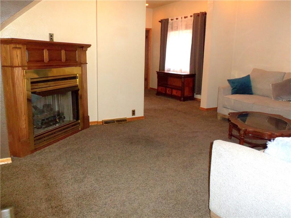 306 Silver Maple Avenue Langeloth, PA 15054 - Photo 7 of 31 a living room with furniture and a fireplace