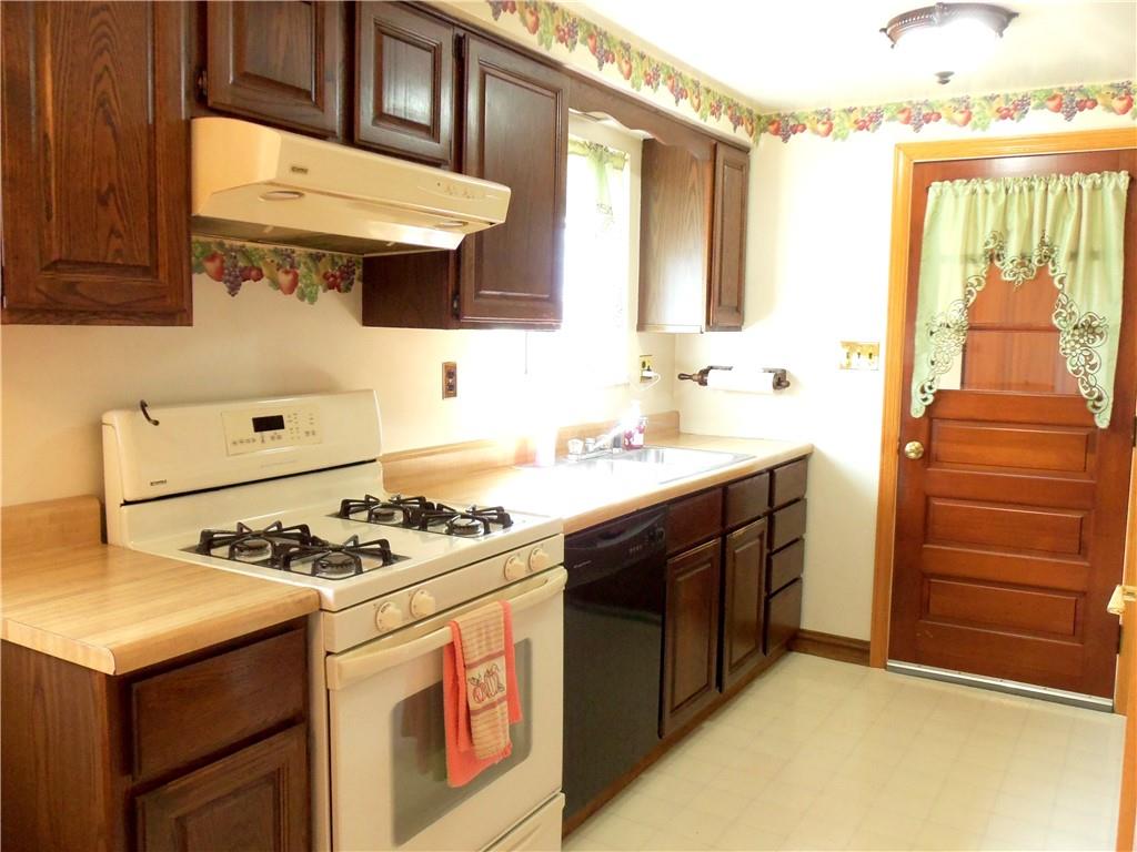 306 Silver Maple Avenue Langeloth, PA 15054 - Photo 8 of 31 a kitchen with stainless steel appliances granite countertop a stove and a sink