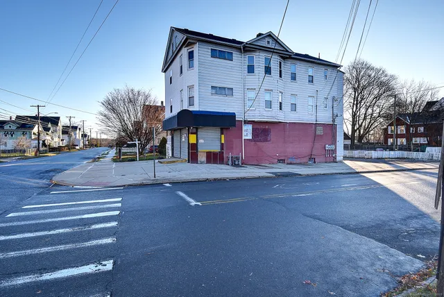 a view of a house with a street