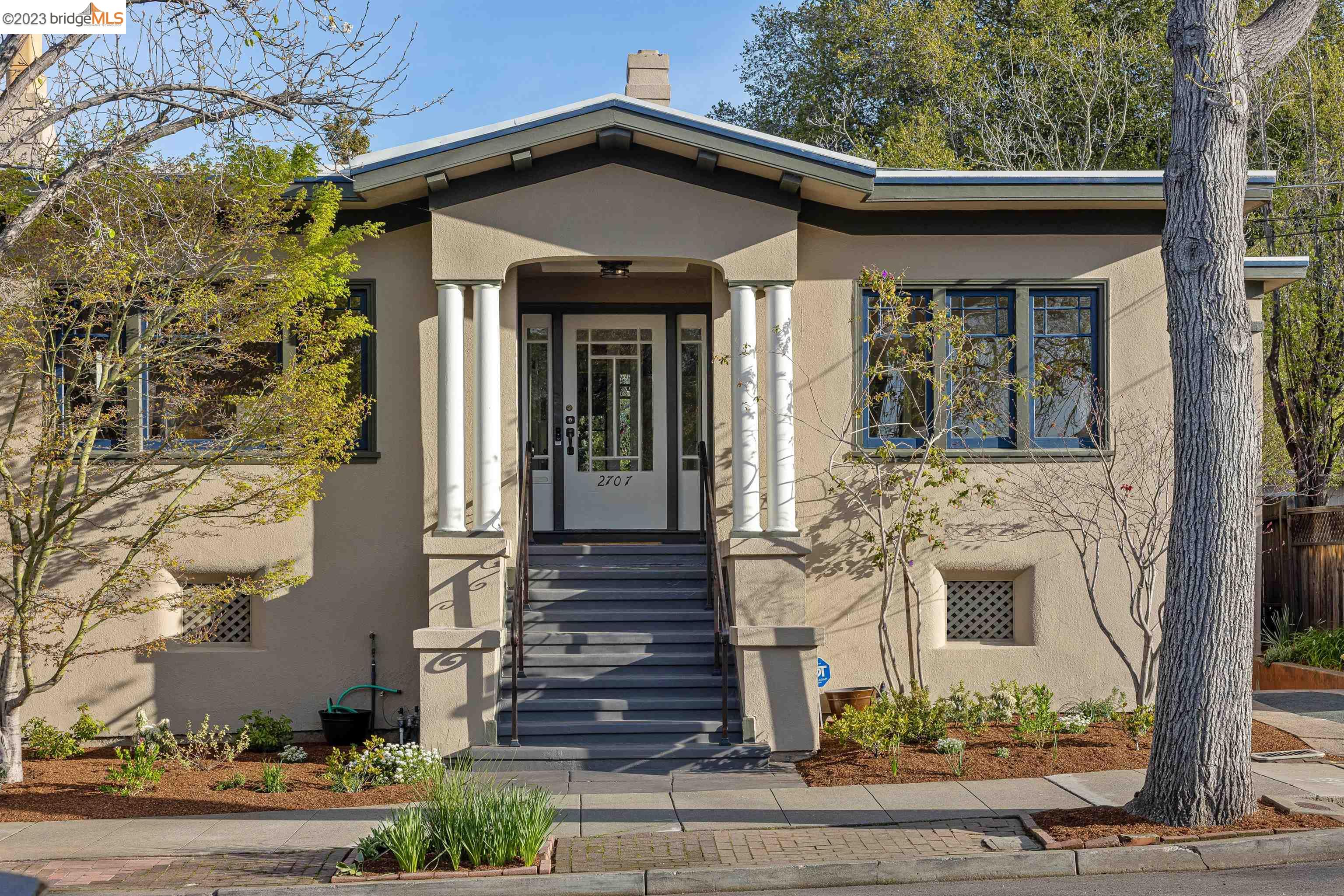 front view of a house with a small yard