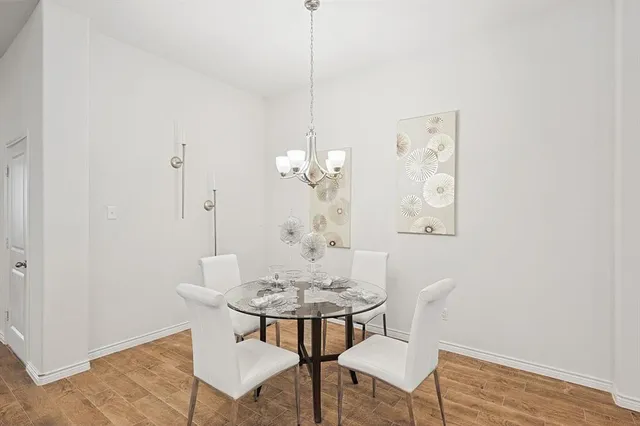 a view of kitchen with dining table and chairs