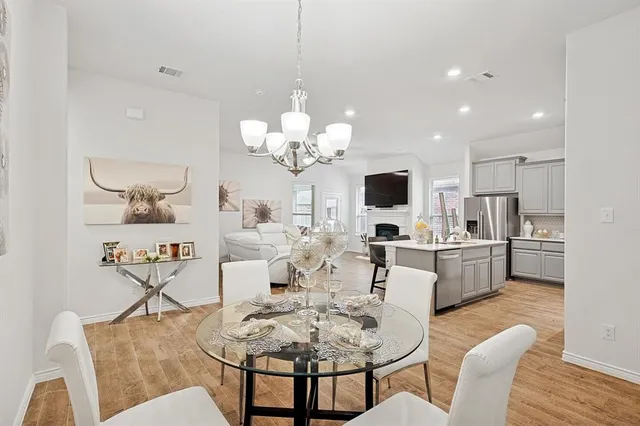 a bedroom with a bed dresser and a window