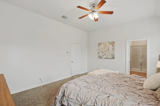 a bathroom with double sink and a mirror