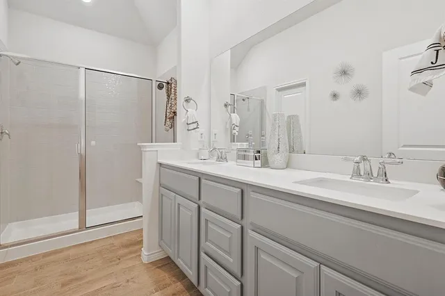 a bathroom with 2 sink and a mirror