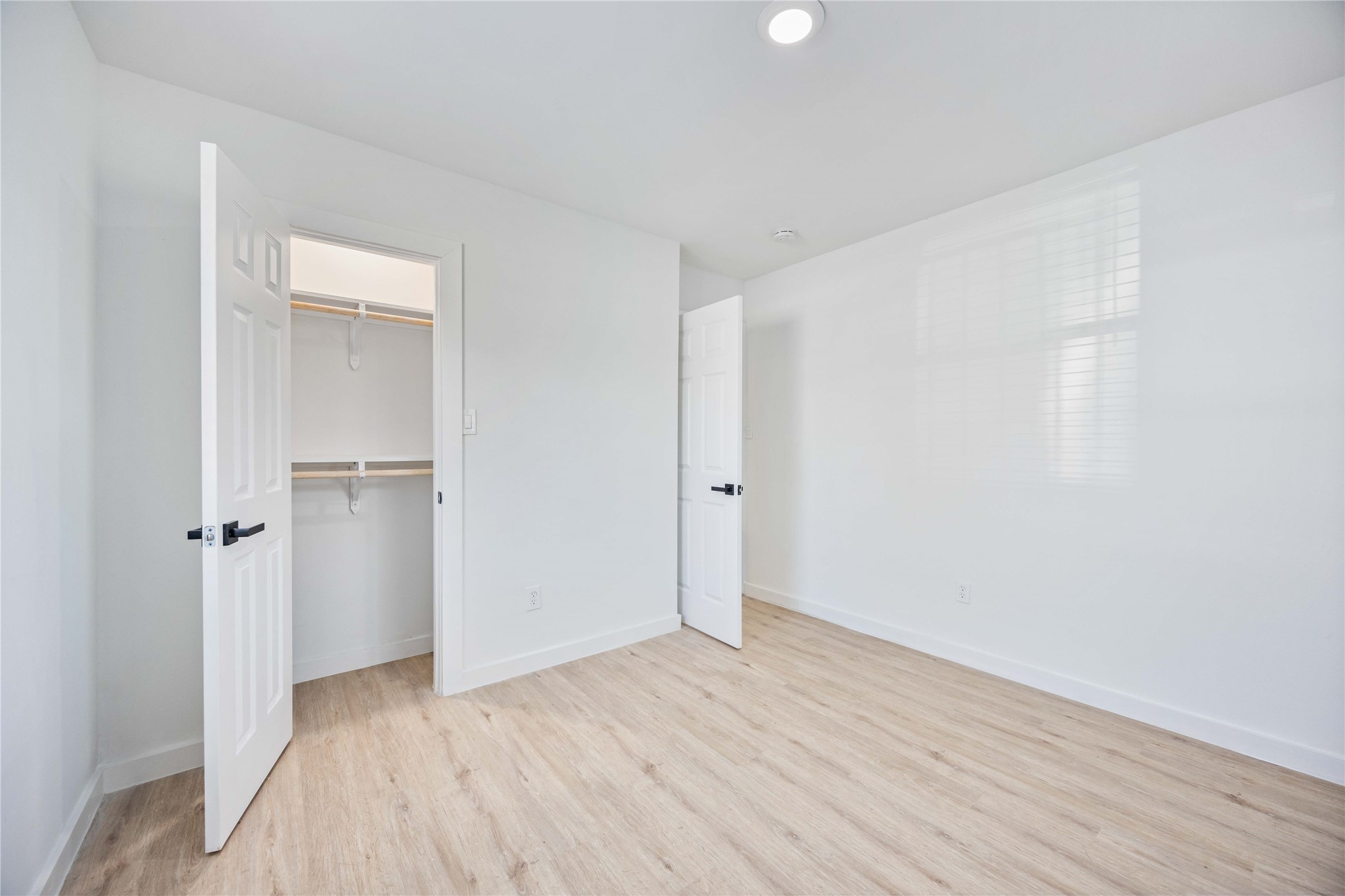 6811 Del Rio Street, Unit 26 Houston, TX 77021 - Photo 13 of 18 a view of an empty room with wooden floor