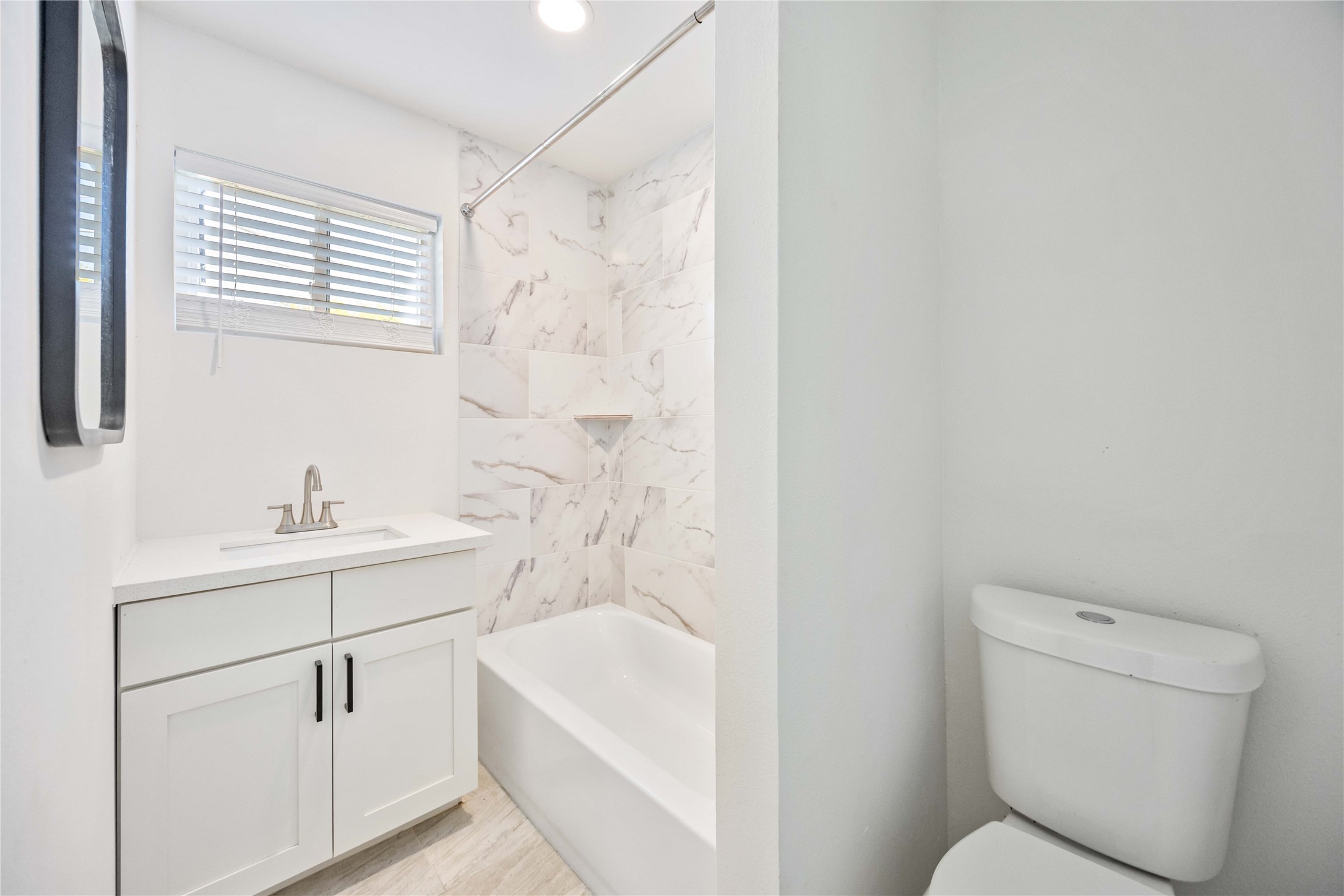 6811 Del Rio Street, Unit 26 Houston, TX 77021 - Photo 15 of 18 a bathroom with a sink a toilet and shower