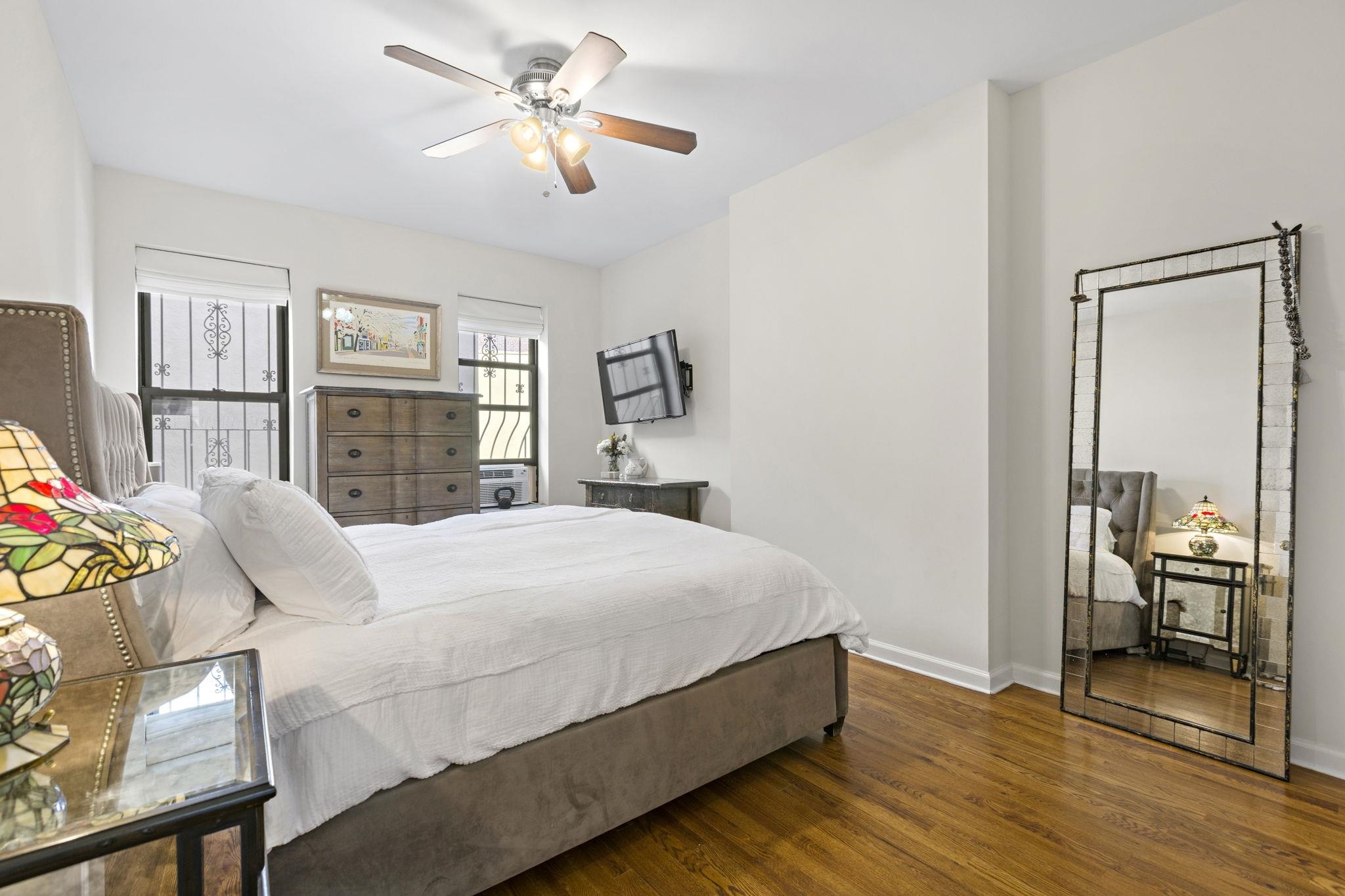 262 1st Street, Unit D Hoboken, NJ 07030 - Photo 11 of 19 a bedroom with a large bed and a chandelier