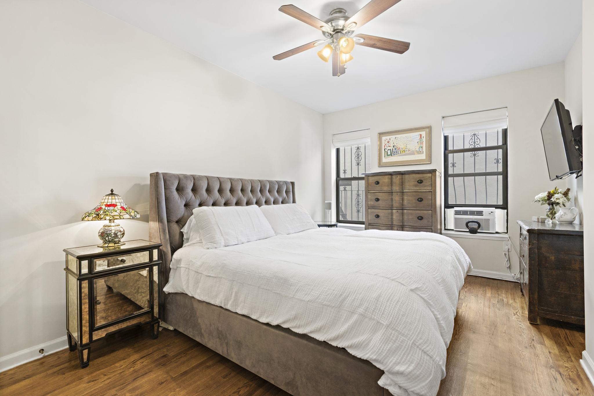 262 1st Street, Unit D Hoboken, NJ 07030 - Photo 12 of 19 a bedroom with a bed and a flat screen tv