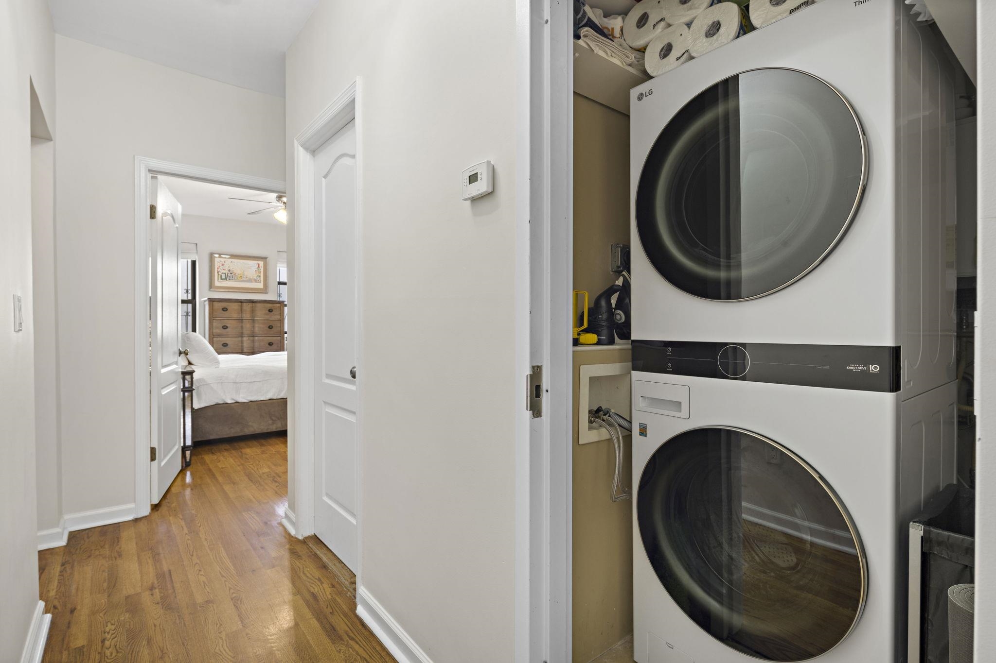 262 1st Street, Unit D Hoboken, NJ 07030 - Photo 16 of 19 a view of a hallway with washer and dryer